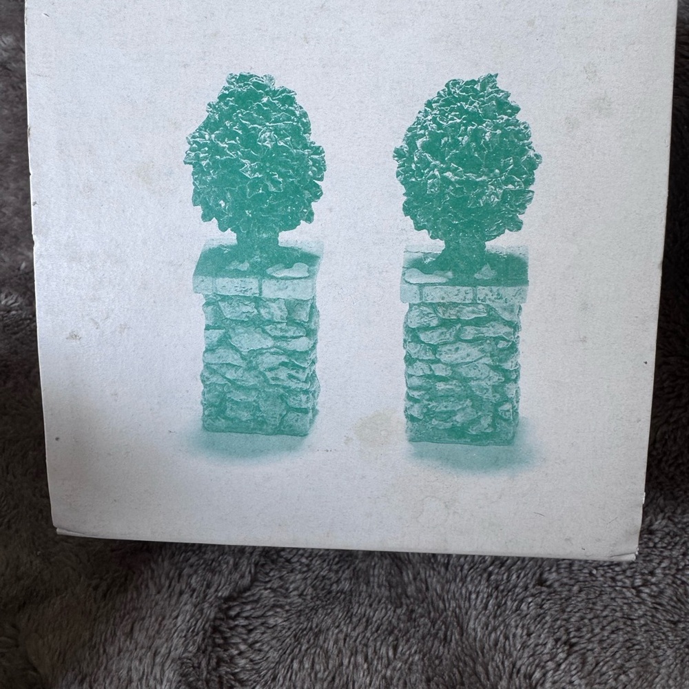 Department 56 stone corner posts with Holly tree